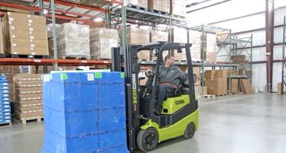 Used Clark cushion tire forklift moving a pallet in a Delaware warehouse