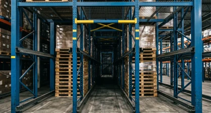 Drive-in pallet rack system with forklift entering the rack structure in a Delaware cold storage warehouse